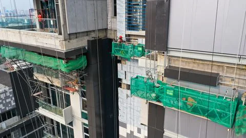 Java, Jakarta, Indonesia, May 20, 2022. Workers are using gondola as vertical Stock Photos