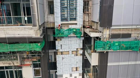 Java, Jakarta, Indonesia, May 20, 2022. Workers are using gondola as vertical Fotos Stock