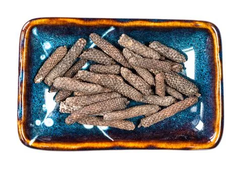 Java long pepper catkins in ceramic bowl cutout Photos