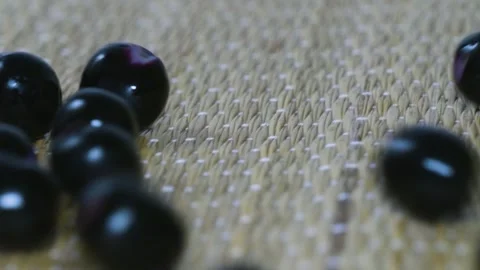 The Java plum fruit fell from the bowl 4k short Stock Footage 252207166