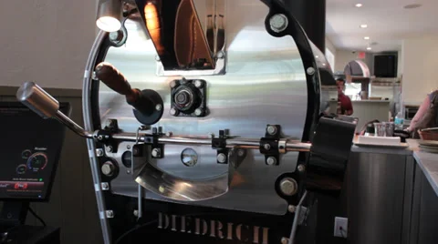Java Shop Barista in Background of Coffee Bean Roaster  Video stock 37256225