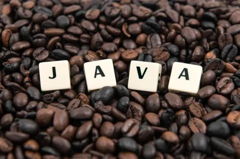 JAVA white cube text on coffee beans background Stock Photos