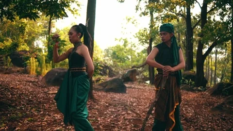 Javanese Couple with Forbidden Fruit Walking Away in Forest Stock Footage 232635830