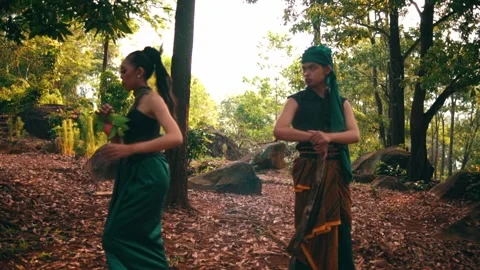 Javanese Couple Separating and Walking Away in a Forest Stock Footage 232635858