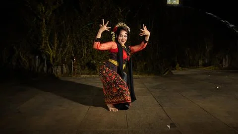 A Javanese dancer makes flexible and flowing movements in time with the rhy.. Stock Photos