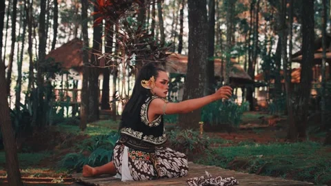 Javanese Dancer Performs Ritual, Throwing Batik Cloth in the Air Stock Footage 313473330