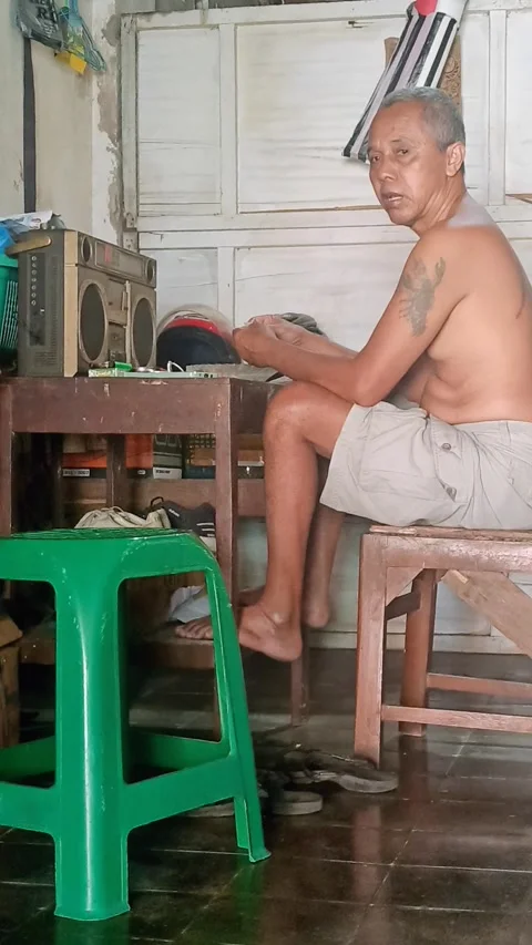 Javanese man having breakfast after exercise Stock Footage 281914827