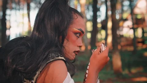 Javanese Man with Makeup Crying into a Batik Handkerchief Stock Footage 313472634