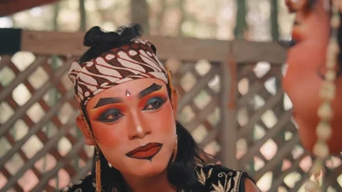Javanese Performer in Traditional Makeup and Batik Headdress Stock Footage 313469109