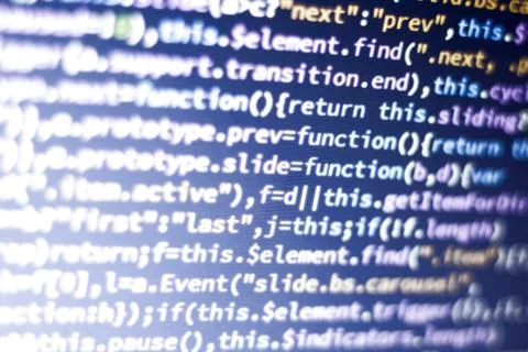 Javascript code. Abstract screen of web developer with glowing code. Stock Photos