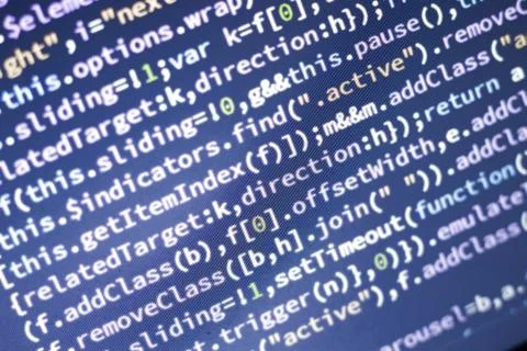 Javascript code. Abstract screen of web developer with glowing code. Stock Photos