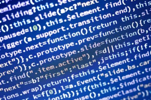 Javascript code. Abstract screen of web developer with glowing code. 写真素材