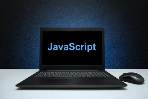 JavaScript text on laptop screen on textured black background with blue light Stockfoto's