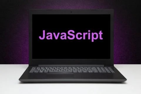 JavaScript text on laptop screen on textured black background with purple l.. Stockfoto's