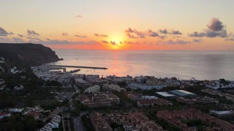 Javea sunset aerial view with harbor, cliffs and Mediterranean coastline 動画素材 337034599