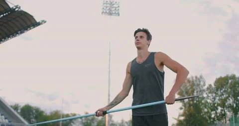 Javelin throw back athlete thrower in track and field event. Undefined athlete Stock-Footage 136507617