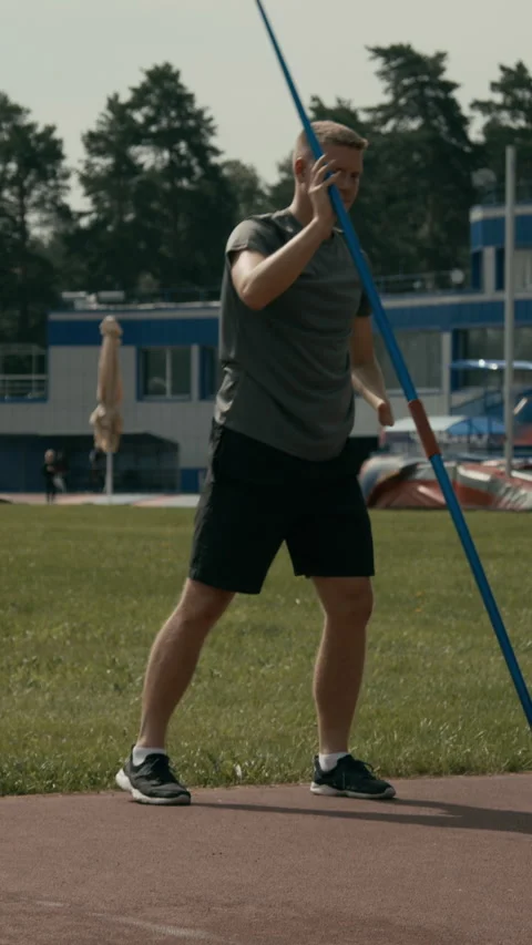 Javelin Thrower with Disability Stretching before Practice at Stadium Video stock 299112021