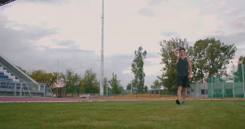 Javelin thrower before a throw. Concentration and exhalation. Excitement and Stock-Footage 136516666