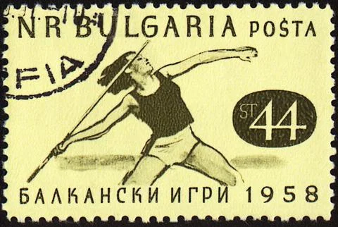 Javelin throwing on post stamp Foto stock