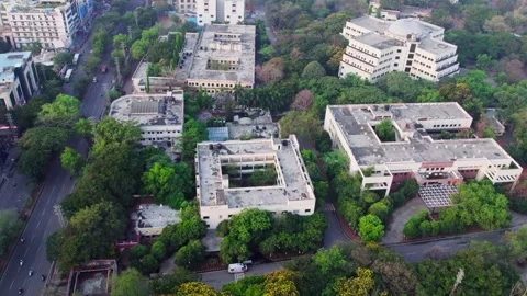Jawaharlal nehru technological university campus with trees and road at Housing Video stock 305631253