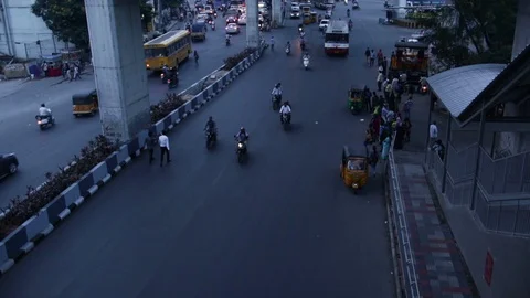 Jaywalking-two-men-walk-leisurely-on-wrong-side-of-the-road-oncoming-traffic Stock Footage 95926819