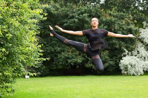 A jazz dancer performing a jump Stock Photos