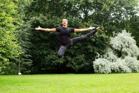 A jazz dancer performing a jump Stock Photos