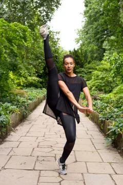 Jazz dancer performing a kick. Stock Photos