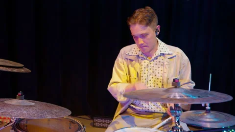 Jazz drummer begins to rhythmically play drums Stock Footage 161812920