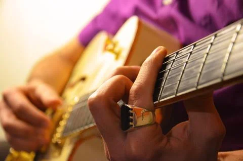 Jazz Guitar Player With Ring Stock Photos