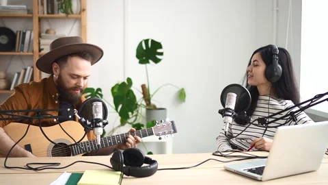 Jazz singer singing song and having fun with woman during radio broadcast at Stock Footage 151745549