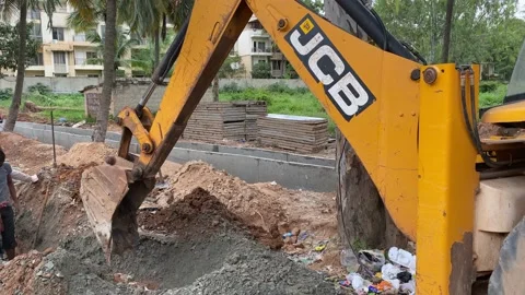 JCB Backhoe Loader Bucket Digs the Ground Stock Footage 163370446
