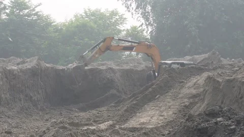 JCB backhoe loaders and are used in the mining industry, India: 10-10-2024 Stock Footage 292054611