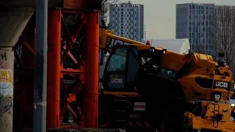 JCB front loader moving some load Stock Footage 171979416
