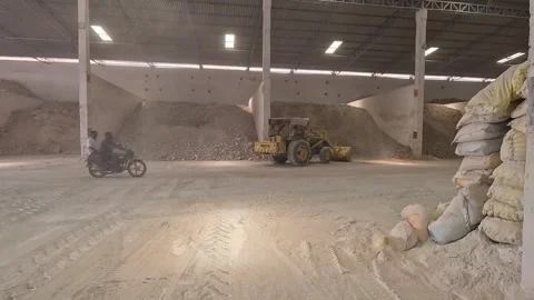 JCB taking soil inside the factory Stock Footage 283429003