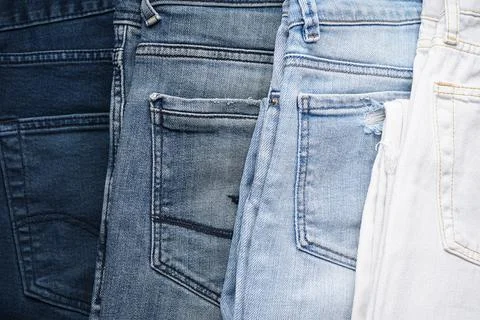 Jeans back pockets, denim background. Close-up. Stock Photos
