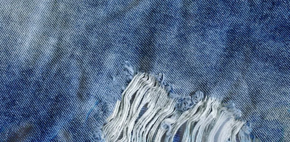 Jeans bit torn Stock Photos