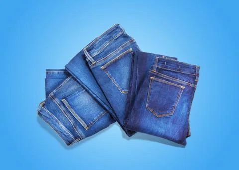 Jeans on blue background Stock Photos