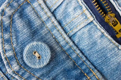 Jeans Button Bottom Left Corner With Part of Pocket and Zip Stock Photos