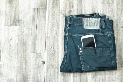 Jeans with cellphone. Stock Photos