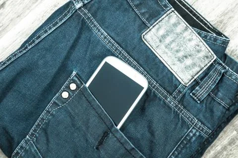 Jeans with cellphone. Stock Photos