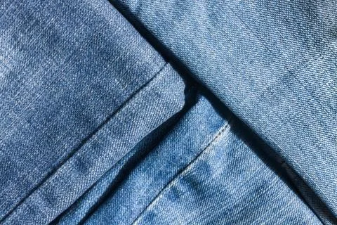 Jeans close-up, texture, torn, mopped pieces. Stock Photos