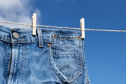 Jeans on a clothesline Stock Photos