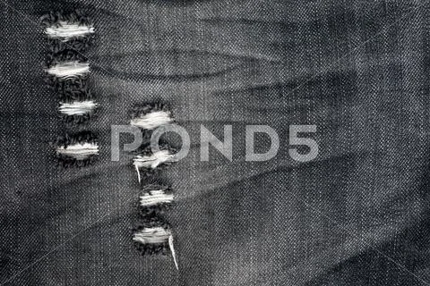 Jeans denim detail tear background Stock Photos