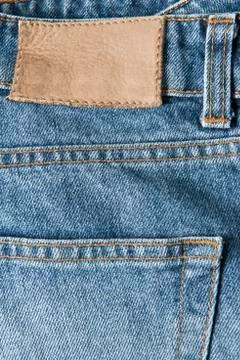 Jeans with empty leather label Stock Photos