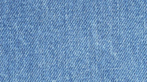 Jeans fabric plain surface background. Denim textile texture tracking Stock Footage 121338424