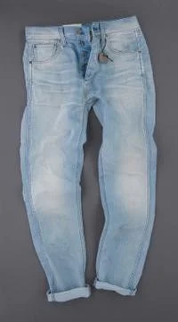 Jeans on grey background Stock Photos