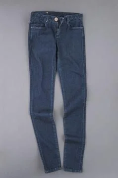 Jeans on grey background Stock Photos