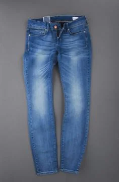 Jeans on grey background Stock Photos