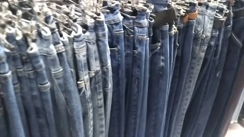Jeans on hangers in a store Stock Footage 308060063